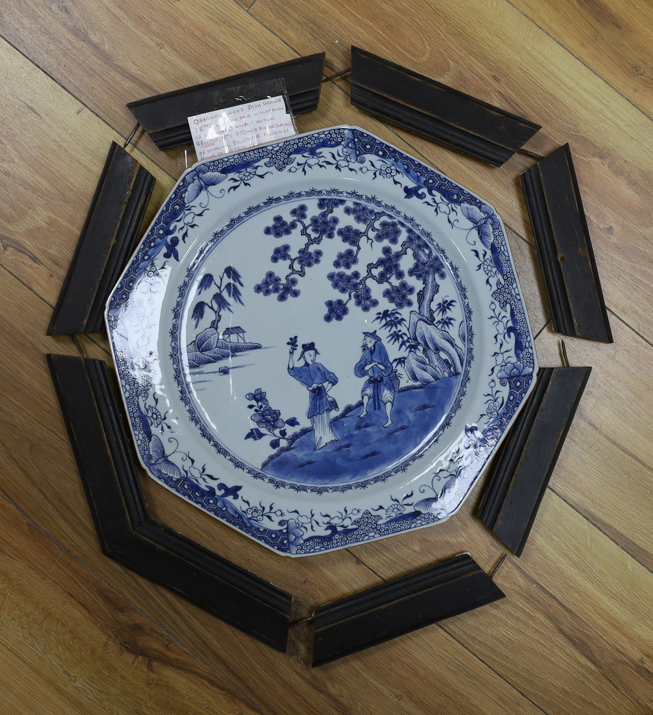 An 18th century Chinese export blue and white dish, Fitzhugh border, together with a contemporary fitted wooden frame 36cm